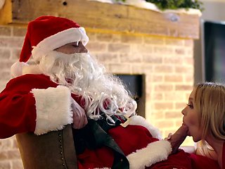 Nikole Nash and Silvia Saige share santa’s cock in a steamy scene.