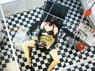 Rubberslut in the clinic masturbates with big dildo and deepthroats
