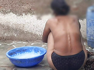 My relative's housewife is taking bath in the open bathroom wearing black underwear at my house