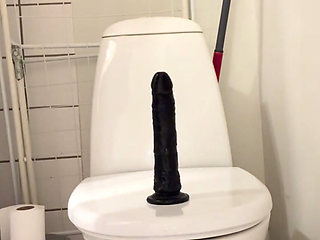 Sit on black dildo