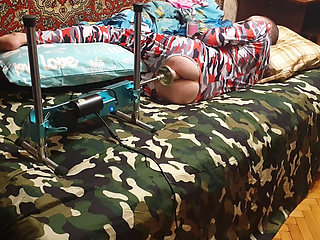 Sasha Earth in an erotic costume having sex with a fuck machine homemade