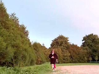 Dressed in a small black skirt and a leopard tie to go do a little something in a parking lot