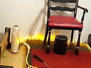 Curvy Brunette Dominatrix Commands Bound Slave in Fetish Dungeon