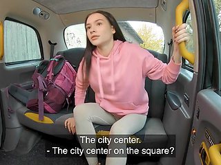 Petite brunette with a cute face is fucked in the taxi