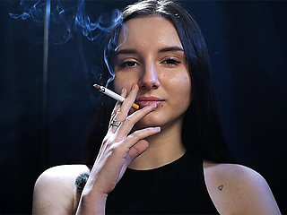 Elegant Brunette Smoking in Black Outfit