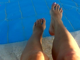 Barefoot Dangling in Swimming Pool Water