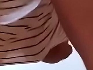 Ebony babe dancing nude in dress - upskirt tease