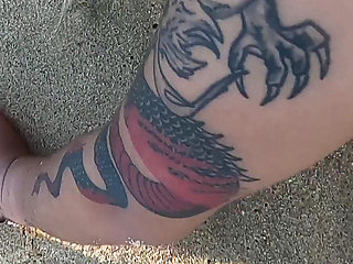 Tattooed MILF Nery Takes Hard Doggy Pounding on Beach