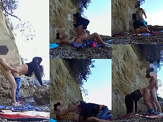 On a beach sex at the risk of being seen