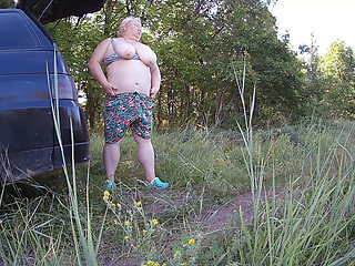 Stepmom masturbates her pussy outdoors