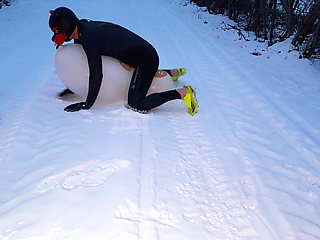 Playing with balloon in the snow
