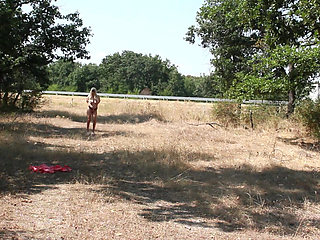 The Littl Tih Girl Shows off Her Tits to the Cars