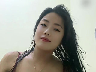 Young mommy looking beautiful after a shower, squeezing her big tits.