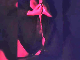 Naughty Brunette in the Dark Room Doing Stripetese